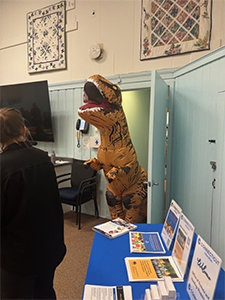 Dinosaur visiting Mansfield Public Library