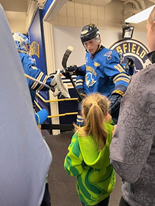 Bordeleau fist bumping the students