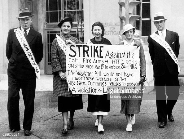 Men and women picketing in front of the FBI office in Washington DC, May 23, 1935, protesting the lack of Federal action in the strike at the Colt Firearms plant in Hartford