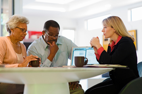 People talk around a table