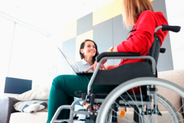 Woman in wheelchair on computer