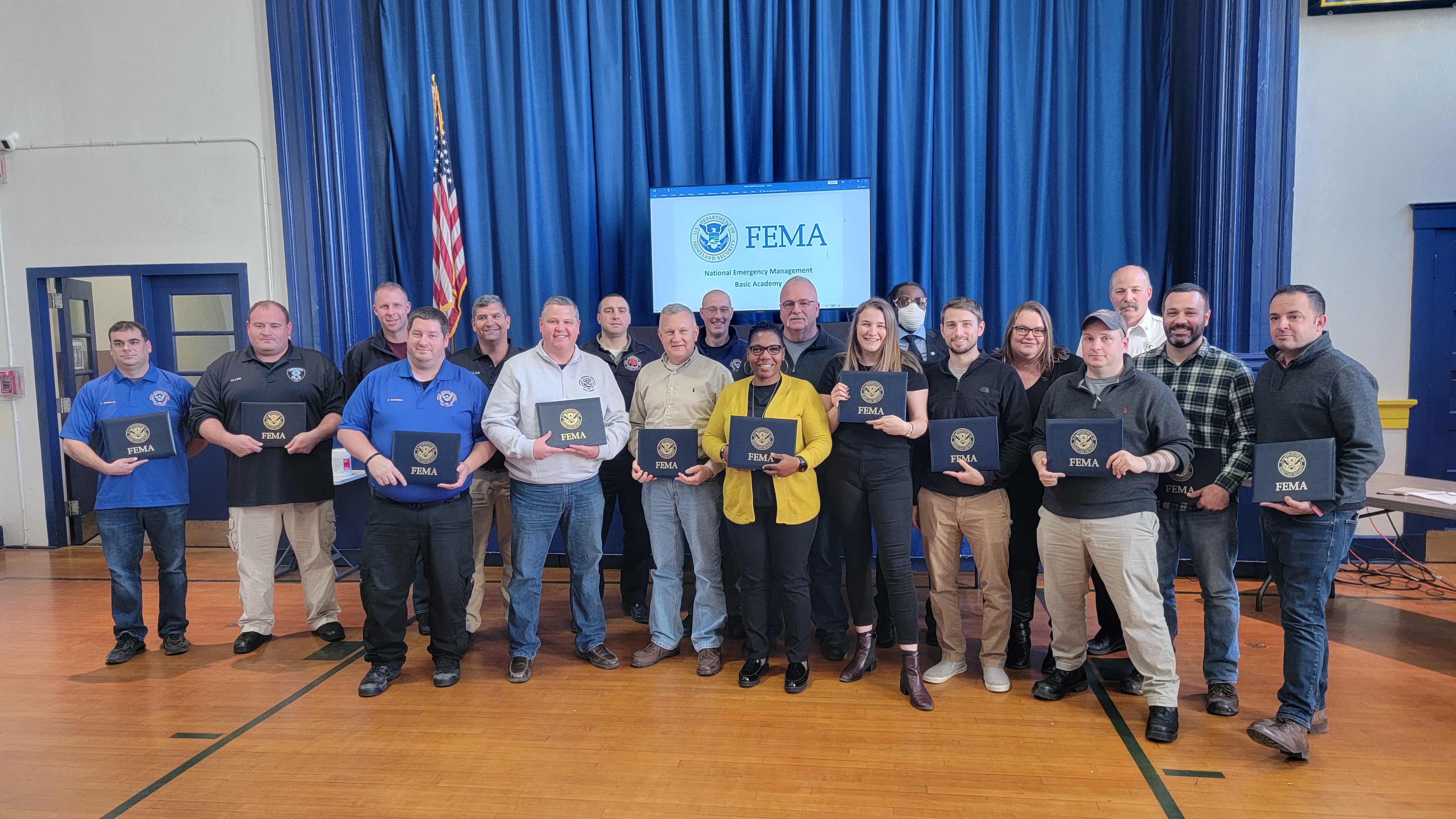FEMA Basic Academy Gradutes Pose with Diplomas
