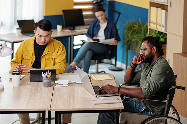 Business people navigating articles on CT websites.