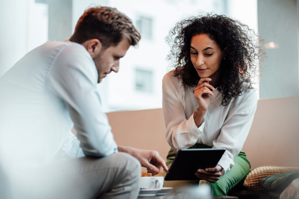 Two people discussing business