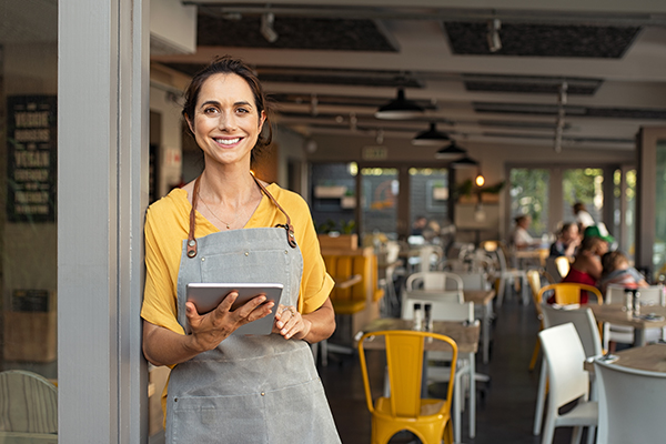 Woman standing outside of restaurant