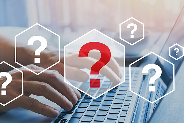 Person typing on keyboard, question marks illustrations overlay.