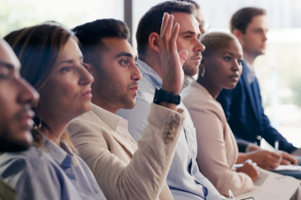Row of people asking questions.