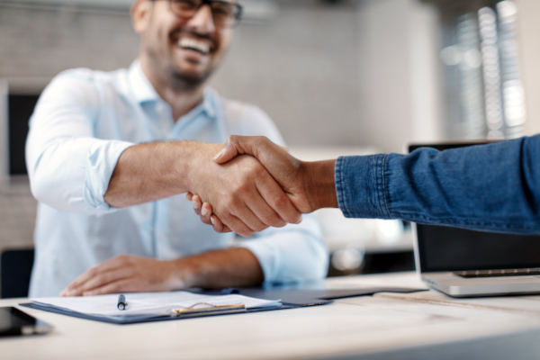 Close up of handshake in the office.