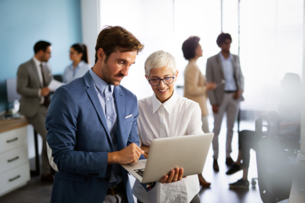 Portrait of successful business people working together in corporate office.