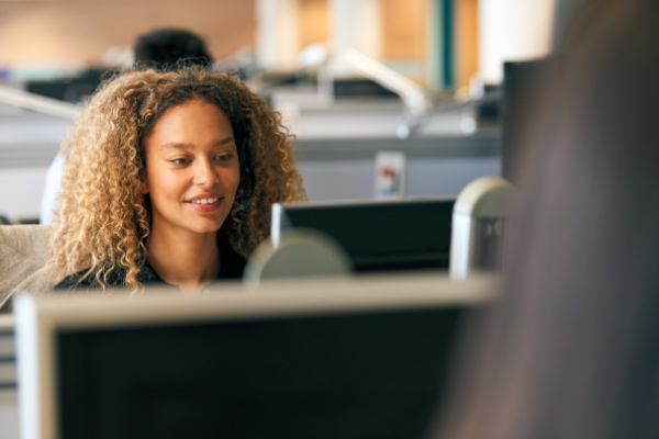 HR employee at computer.