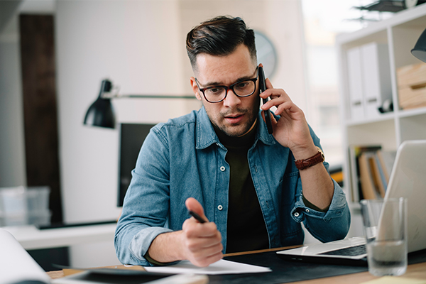 Serious man on the telephone