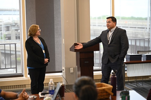 Commissioner Michelle Gilman and Deputy Commissioner Nick Hermes speak at an Aspiring Leaders Development Program graduation