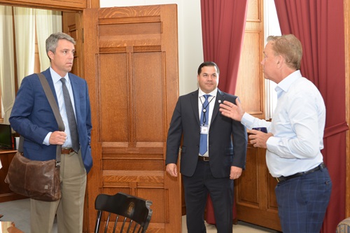 Gov. Ned Lamont greets Nick Hermes and Josh Geballe as he prepares to sign EO 2, July 31, 2019 Josh Geballe and Nick Hermes speak with Gov. Ned Lamont