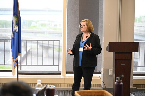 Commissioner Michelle Gilman speaks at an event