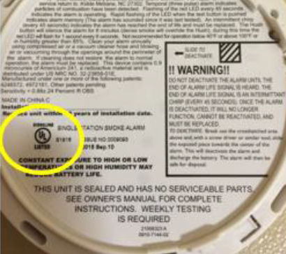 An image of the circular UL logo on the bottom of a smoke or carbon monoxide alarm