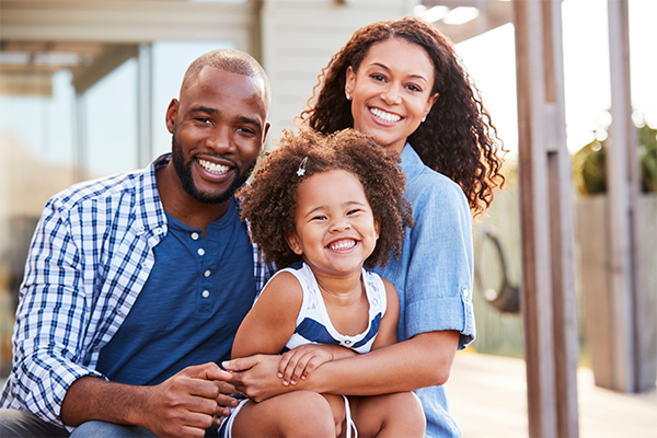 family embracing outdoors