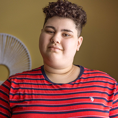 youth with curly short brown hair