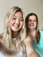 Photo of Lily smiling happily with a relative