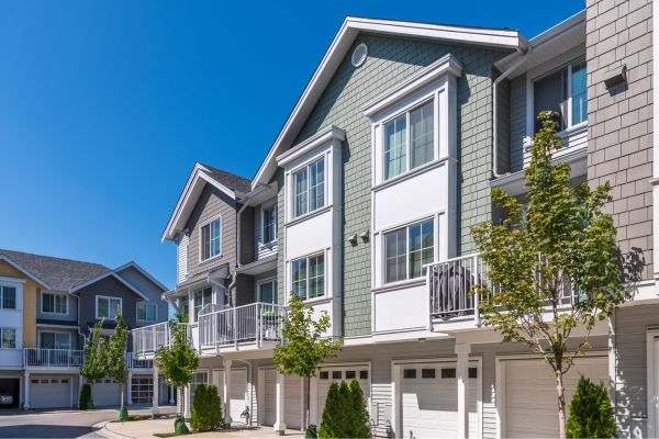 Image of a condominium complex with blue skies in the background