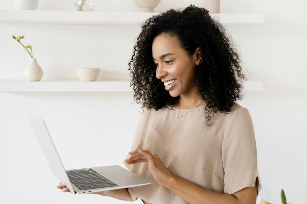 woman smiling with laptop