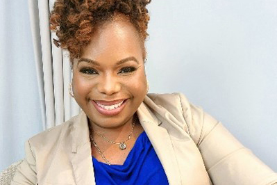 A professional headshot of Diya Wynn