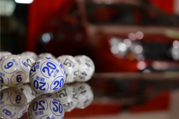 Image of several bingo balls. Front bingo ball displays the number 20.