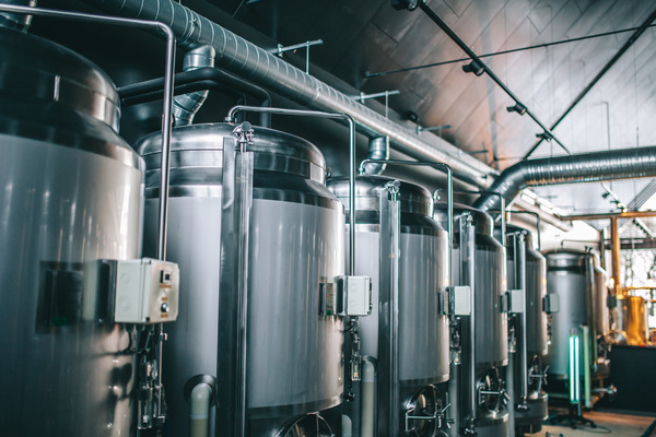 Interior of brewery showing round copper tanks for beer fermentation 
