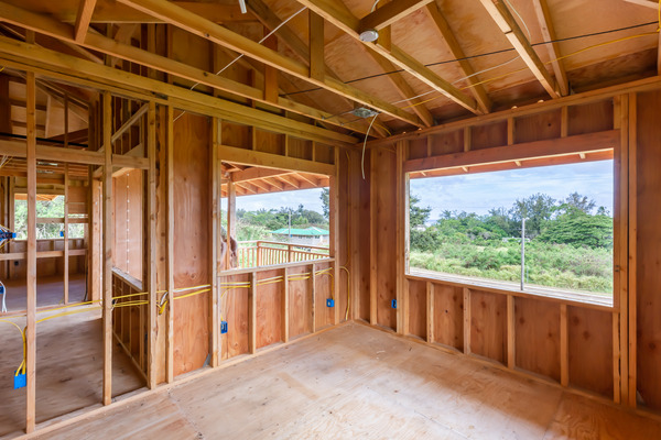 Image of an unfinished home improvement project showing exposed wood beams