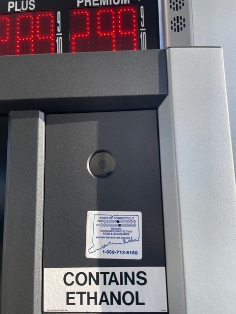 Blue and white stickers indicate the last time a gas pump was inspected by DCP. Station pumps are typically inspected every two years.