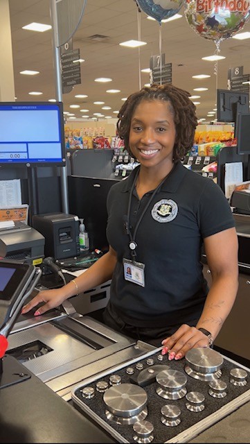 DCP Weights and Measures Inspector Shay Tubbs demonstrates a field test on a grocery store checkout scale.