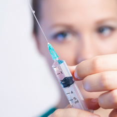 Preparing vaccine syringe