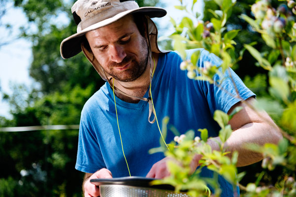 individual smelling flowers