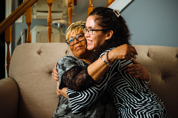 provider and individual smiling for picture