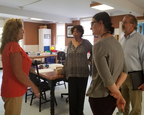 Representative Wilson Pheanious and DDS staff Rod O’Connor and Krista Ostaszewski listen to Day Program Supervisor, Donna Munson