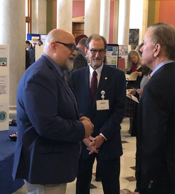 DDS Director of Business Intelligence and Analytics, Josh Scalora and Oak Hill Vice President for Public Policy and External Affairs Stan Soby discuss interagency efficiency efforts with Governor Lamont.