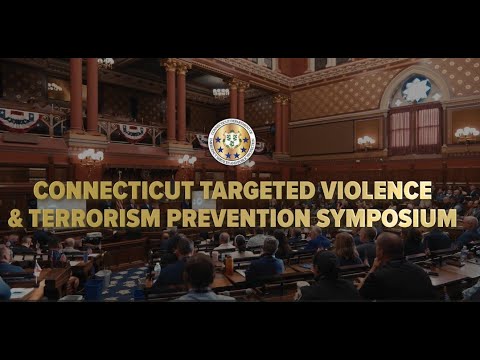 Attendees are gathered at a conference in a historic building to discuss targeted violence and terrorism prevention, as part of the ‘Connecticut Targeted Violence & Terrorism Prevention Symposium.’