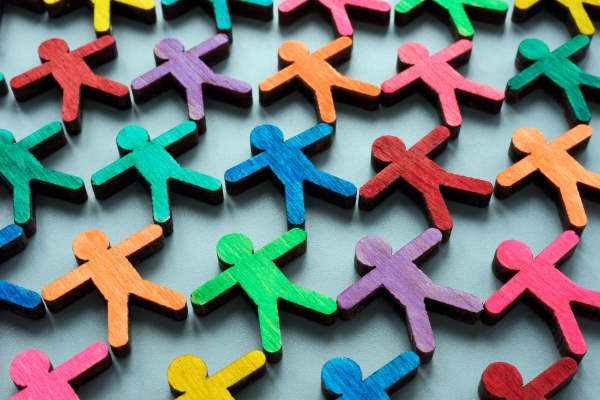 colored wooden cutouts showing interlocking people