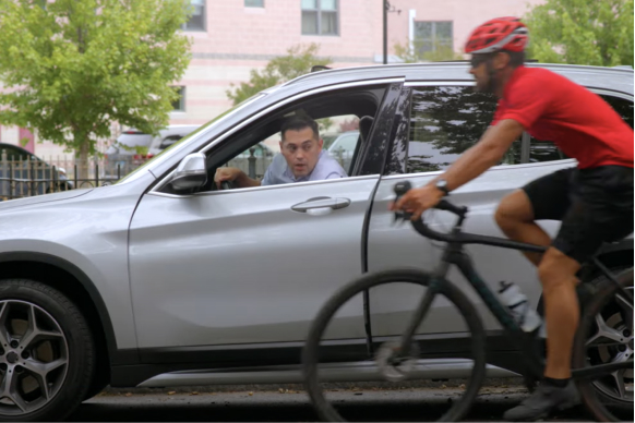 driver openning door as cyclists passing by - pedestrian cycle safety