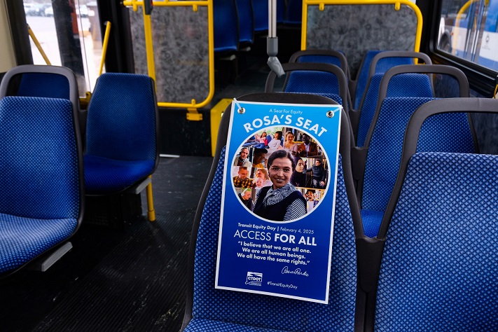 Transit Equity Day 2025 poster hung on bus seat