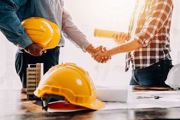 construction workers shaking hands