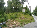picture of land and bid sign