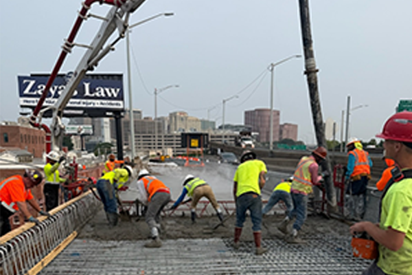 Crews pouring and shaping concrete for the new bridge deck on I-91 SB.