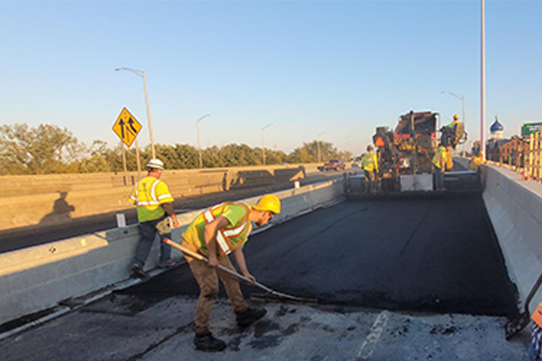 Crews paving the Whitehead Highway on-ramp to I-91 SB.
