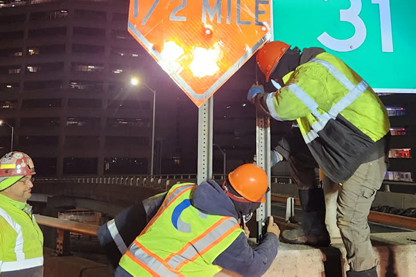 February 2025: Nighttime installation of signage.