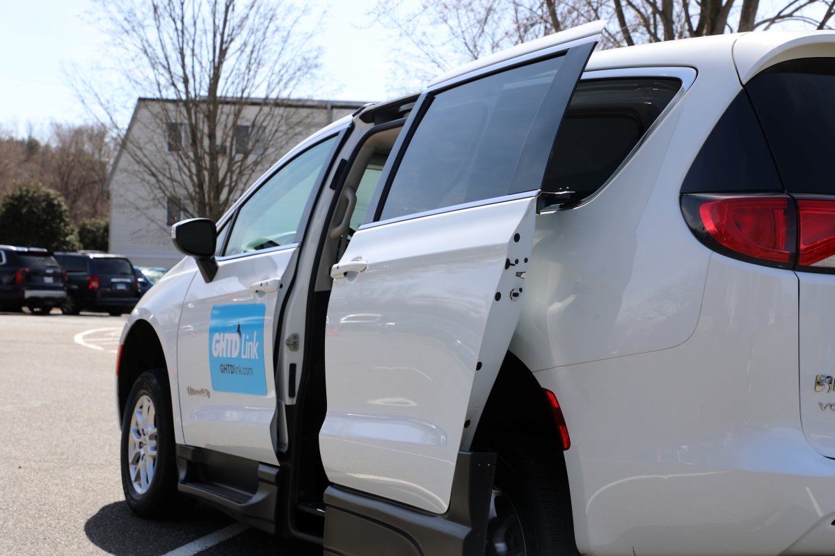 Close up of microtransit van from the greater hartford transit district with ramp exposed and extended.
