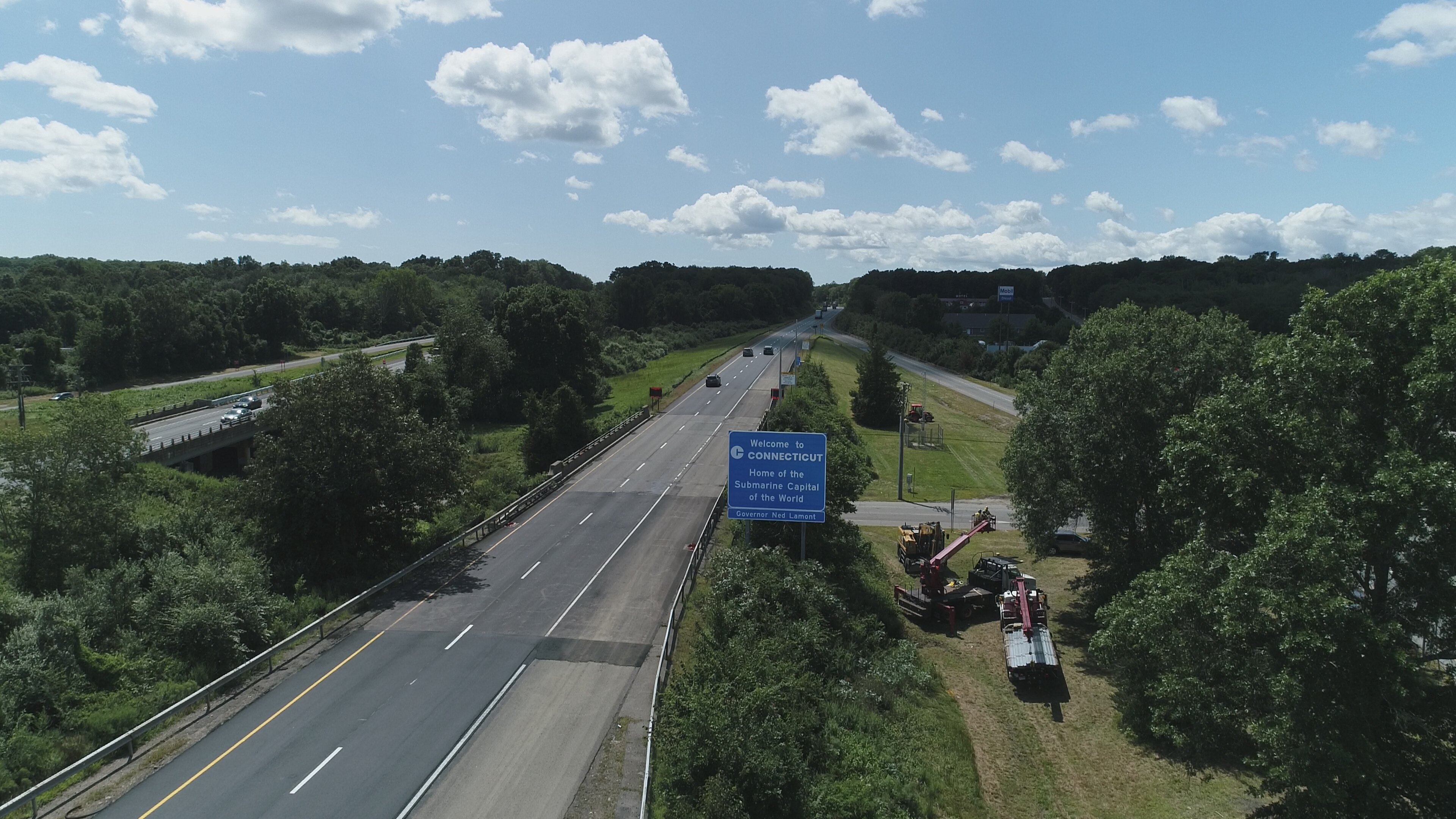 Interstate highway sign that says, "Welcome to Connecticut, Home of the Submarine Capital of the World."