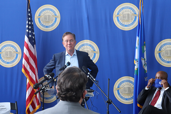 Governor Lamont preparing to talk to the Press.