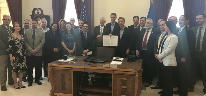 Governor Lamont signing Executive Order 1