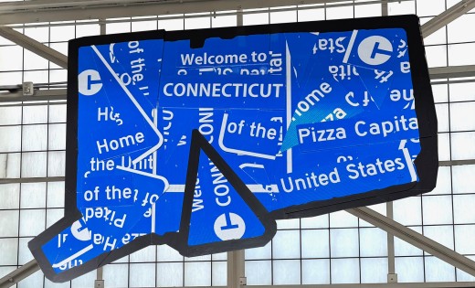 The Pizza State art installation made of Connecticut highway signs