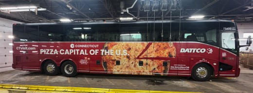 DATTCO bus with a photo of pizza and text that says "Pizza Capital of the U.S."